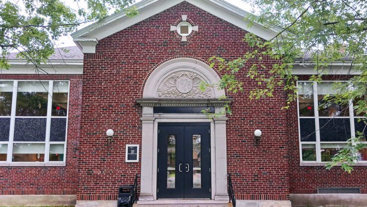 The Blake Library entrance facing University Drive, which sits beneath the library's belltower